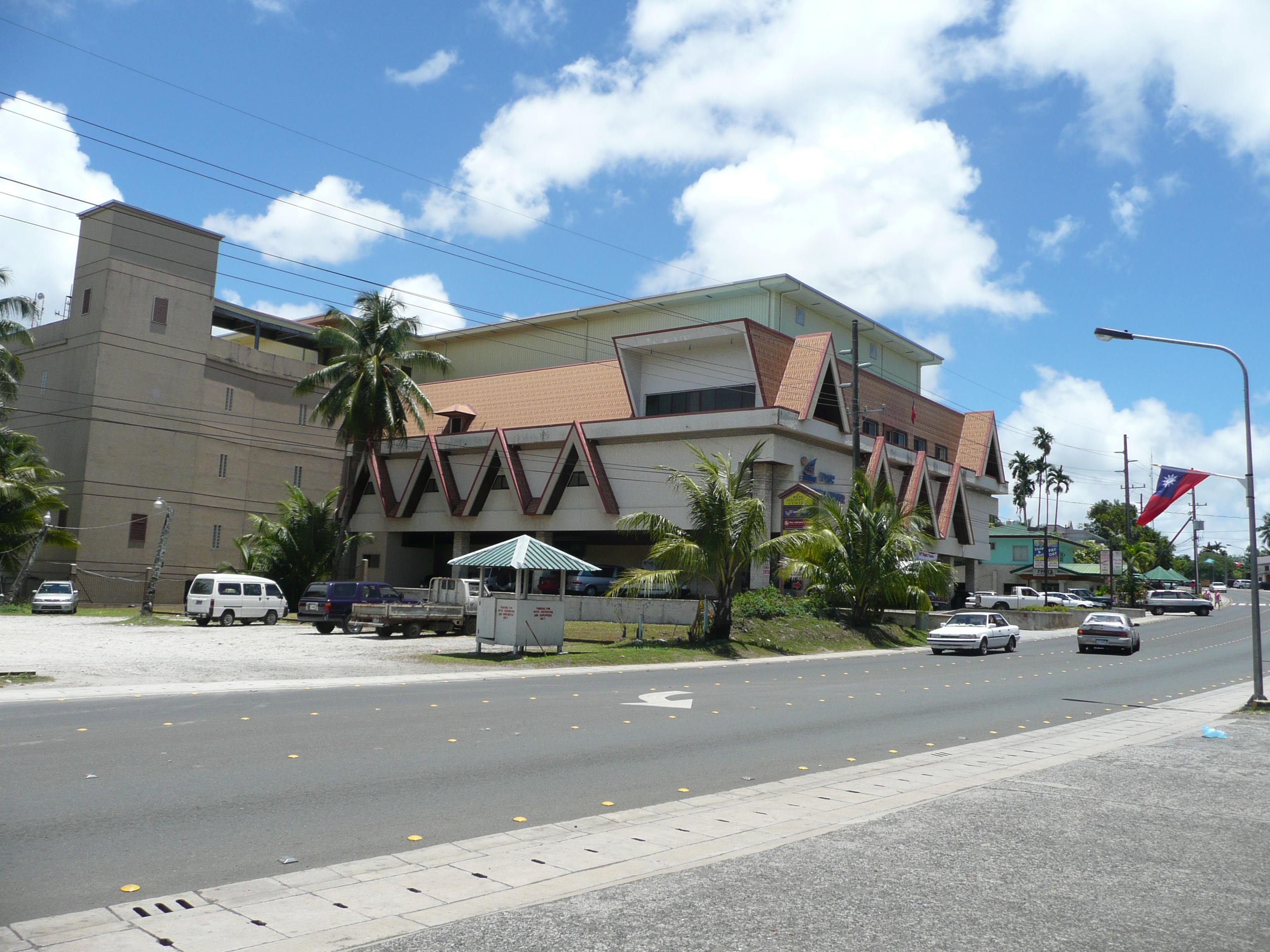 alt=Exterior view of a multi-story shopping center building.