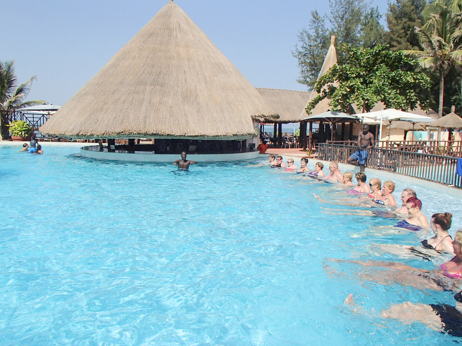 Tourists at a hotel swimming pool in The Gambia, 2014. Tourism is a key sector of the Gambian economy.