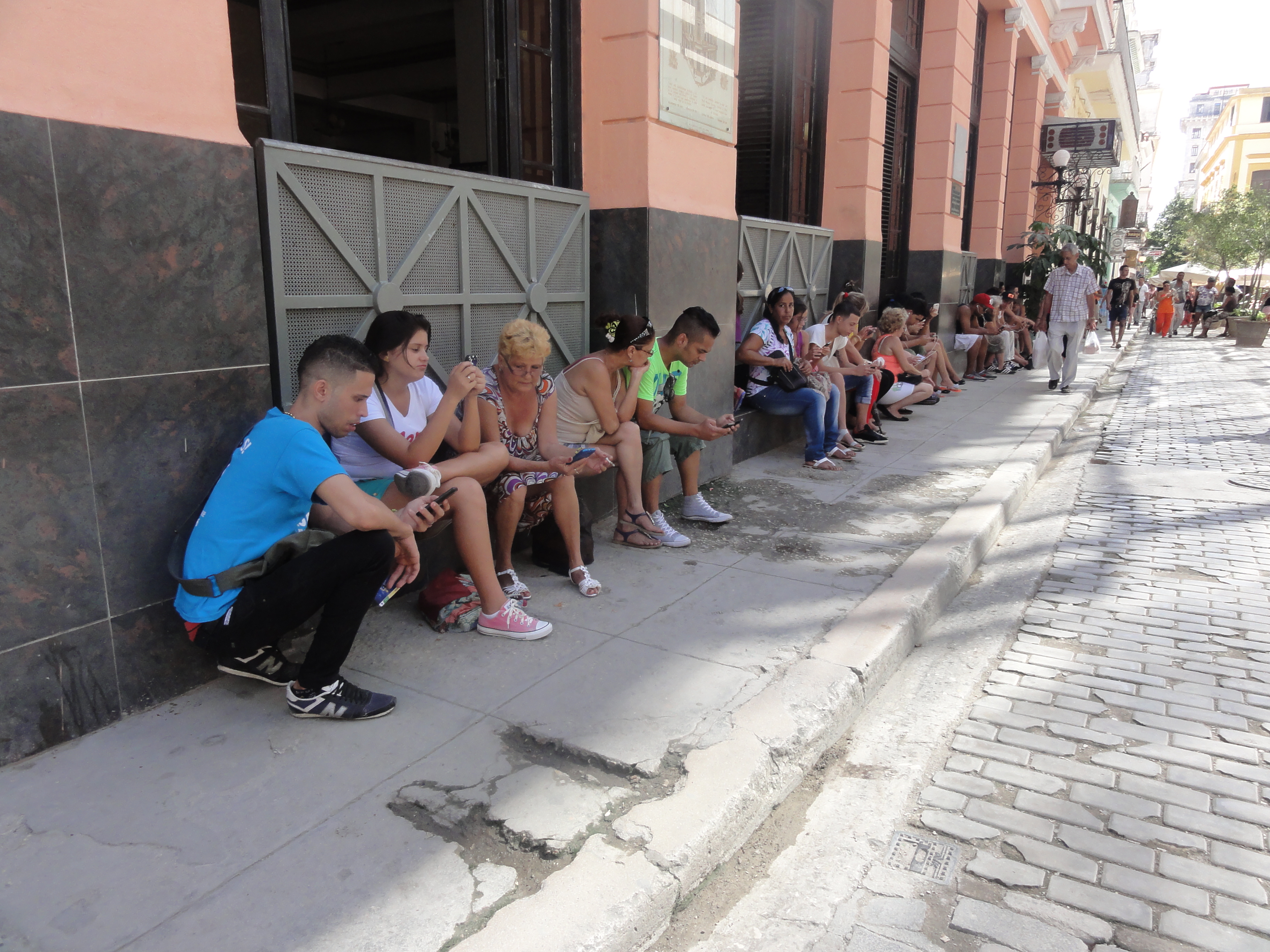Users of a public Wi-Fi hotspot in Havana. Internet access has expanded but remains controlled and can be costly for many Cubans.