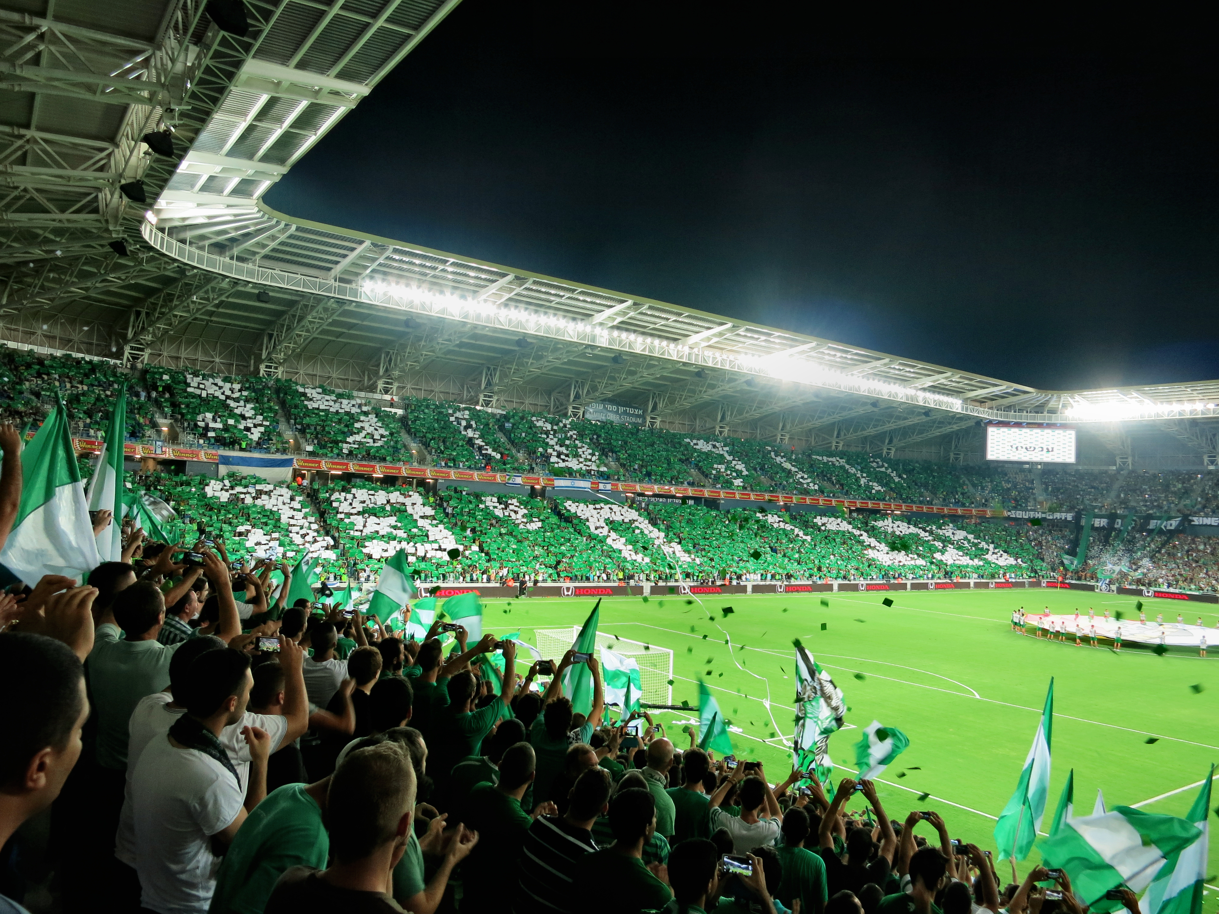 Maccabi Haifa F.C. fans at Sammy Ofer Stadium in the city of Haifa. Football (soccer) is one of the most popular sports in Israel.