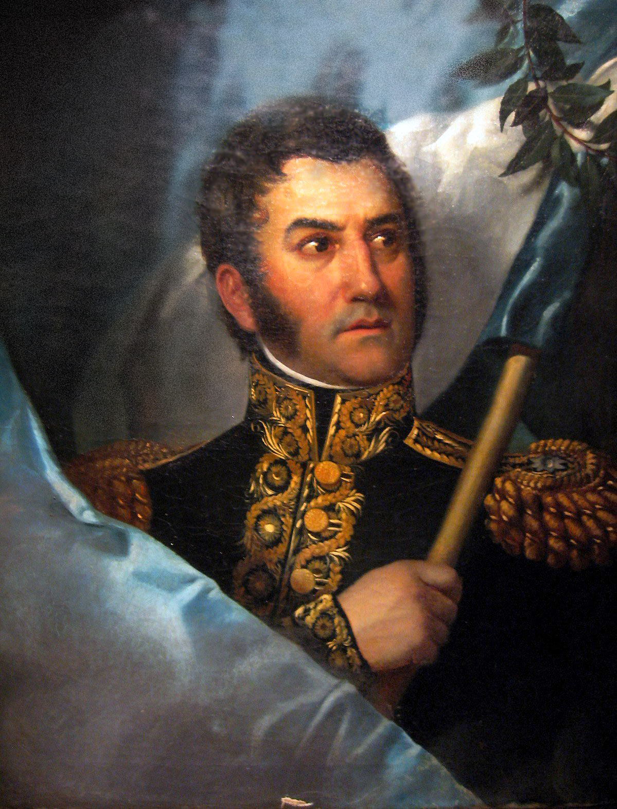 alt=Lukisan San Martín memegang bendera Argentina