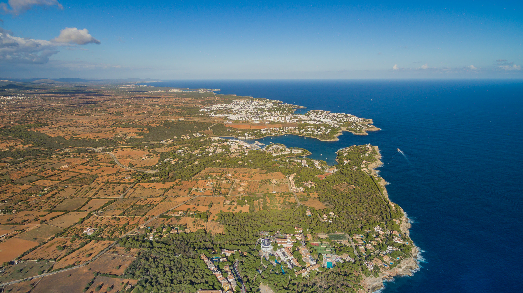 Aerial view of a cove in Mallorca, Balearic Islands, a major tourist destination in the Mediterranean.