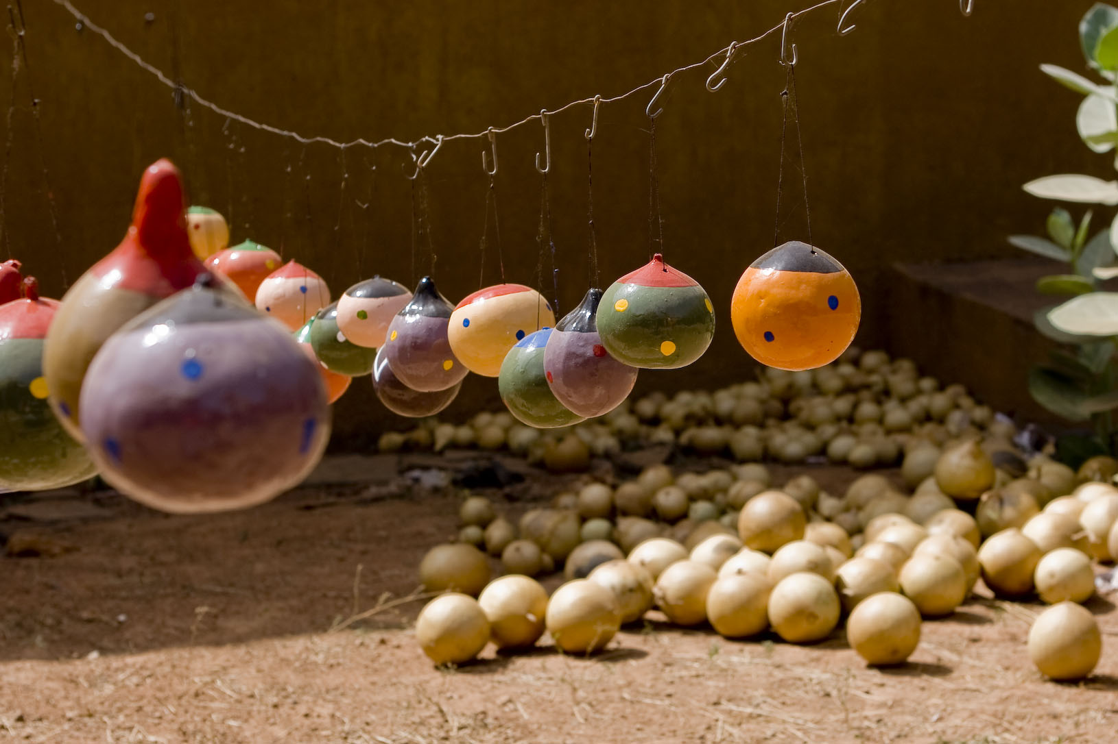 Artisan garland of decorative painted gourds in Ouagadougou.