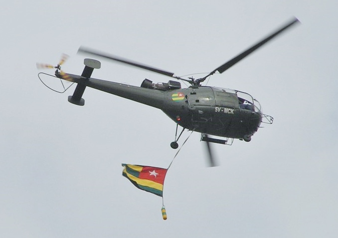 An Alouette III helicopter of the Togolese Air Force, displaying the national flag.