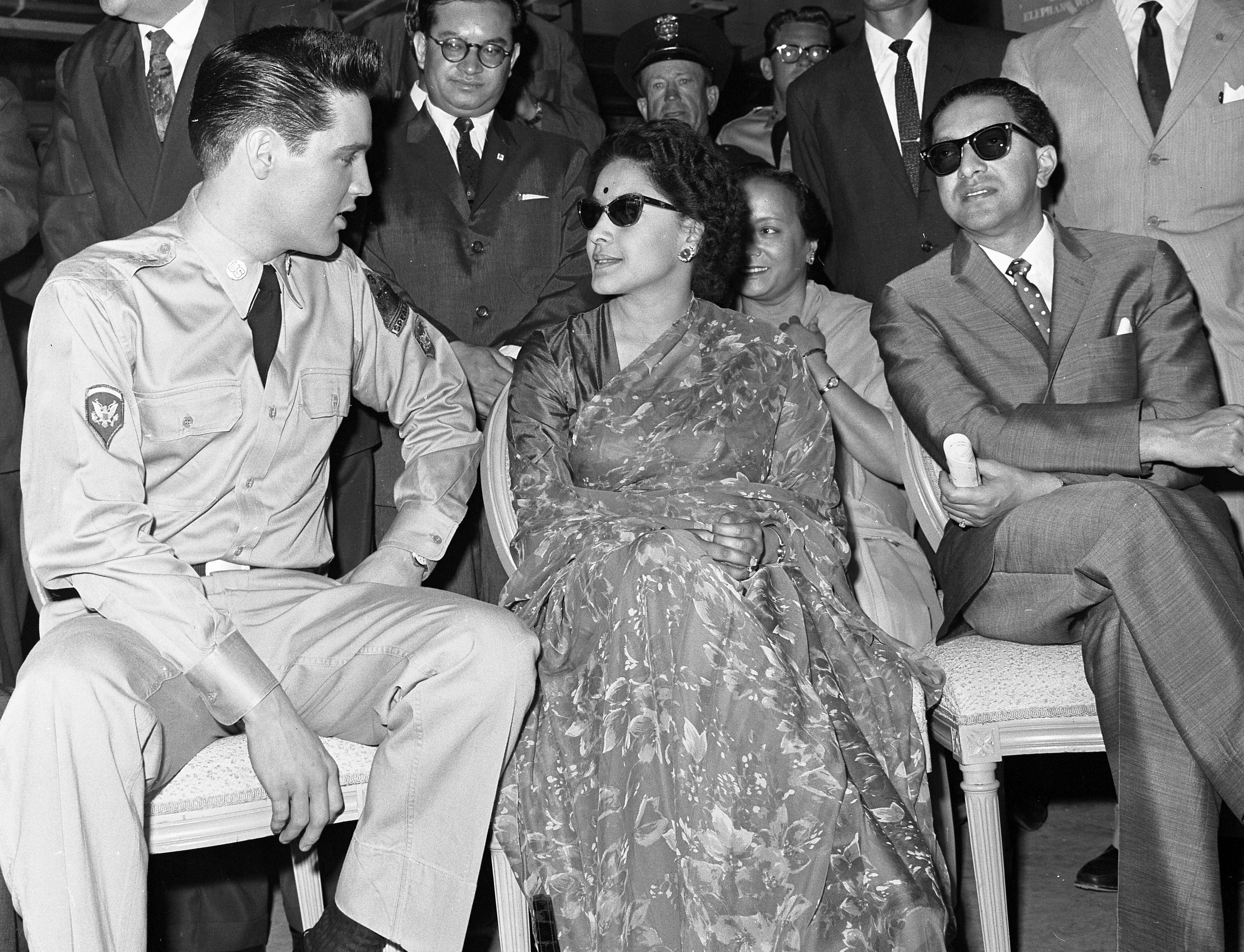 Elvis Presley with King Mahendra and Queen Ratna of Nepal in 1960.
