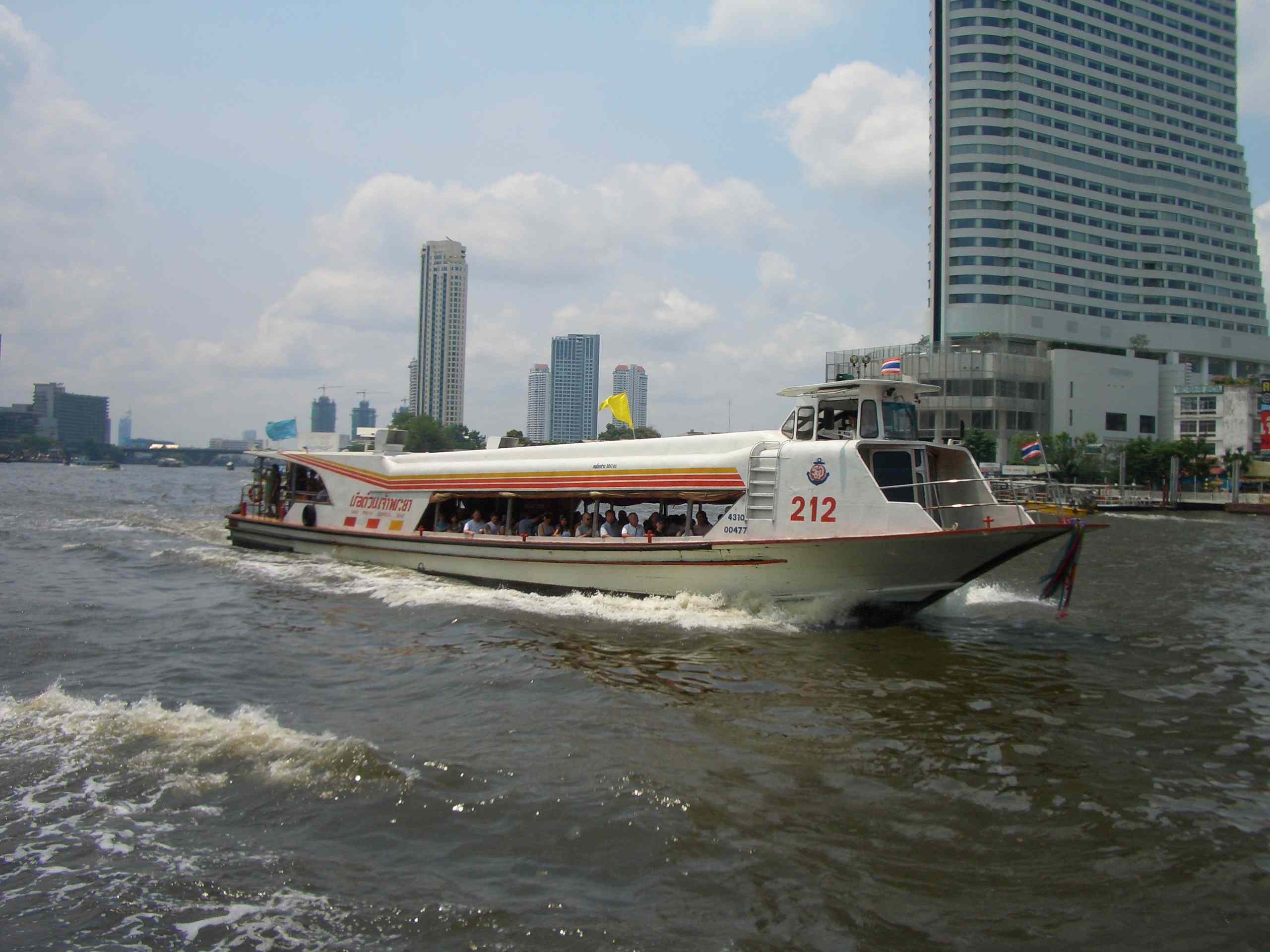 A Chao Phraya Express Boat on the Chao Phraya River in Bangkok. Water transport remains an important mode of travel and goods movement, especially in the capital.