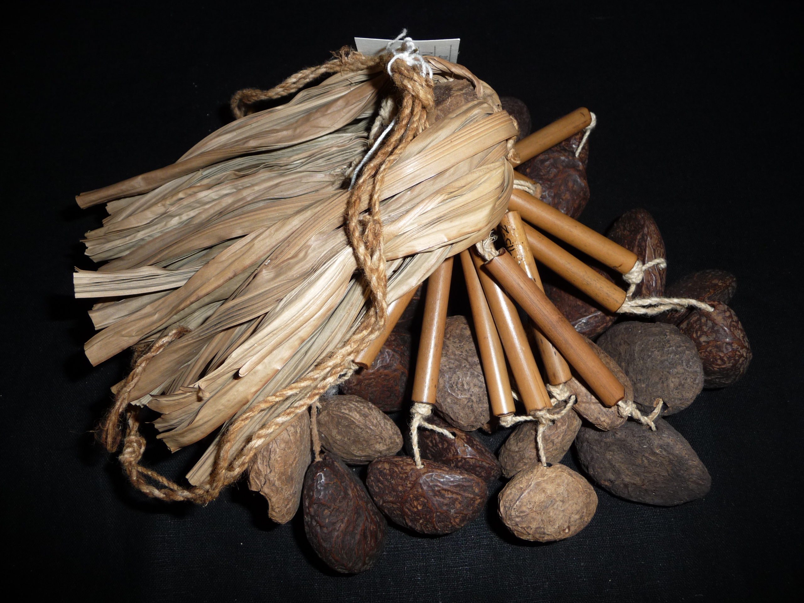 A rattle made from leaves, seeds, and coconut shells, worn by dancers on their ankles to create rhythmic sounds during performances.